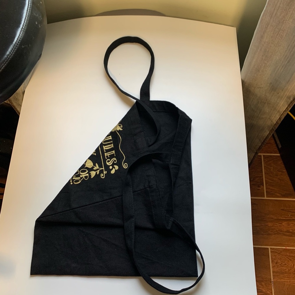 BLACK TOTE BAG with gold lettering.